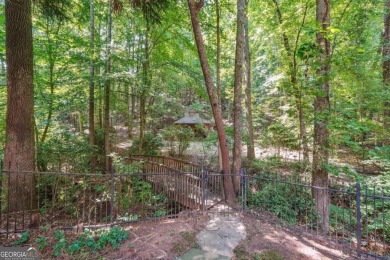 Experience three fully finished levels of exceptional living on The Golf Club of Georgia in Georgia - for sale on GolfHomes.com, golf home, golf lot