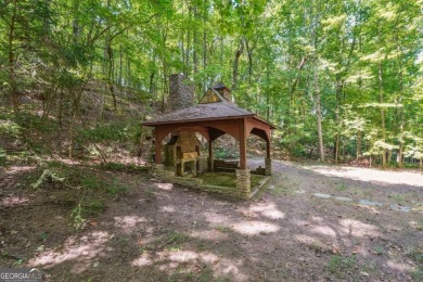 Experience three fully finished levels of exceptional living on The Golf Club of Georgia in Georgia - for sale on GolfHomes.com, golf home, golf lot