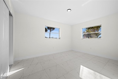 Beautifully updated pool home located on a golf course, offering on Rotonda Golf and Country Club The Hills Course in Florida - for sale on GolfHomes.com, golf home, golf lot