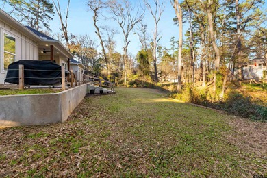 This inviting home welcomes you the moment you step through the on Hide-A-Way Lake Golf Course in Texas - for sale on GolfHomes.com, golf home, golf lot