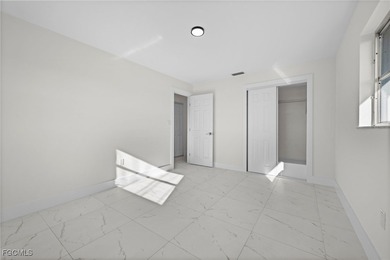 Beautifully updated pool home located on a golf course, offering on Rotonda Golf and Country Club The Hills Course in Florida - for sale on GolfHomes.com, golf home, golf lot