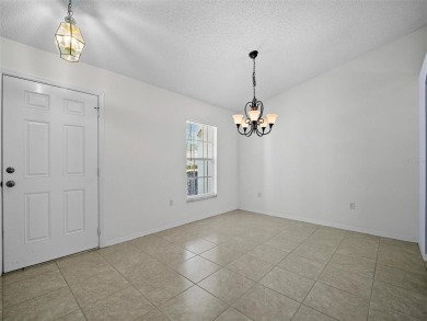 Better Than New! 3 Bed, 2 Bath Home with Screened Porch and on The Grand Club Cypress Course in Florida - for sale on GolfHomes.com, golf home, golf lot