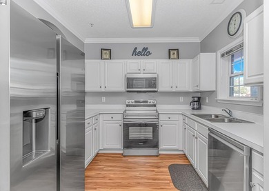 Beautiful first floor 2 bedroom 2 bath golf course condo located on Barefoot Resort and Golf Club  in South Carolina - for sale on GolfHomes.com, golf home, golf lot