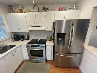 Enjoy serene lake views and resort-style living in this on Sunrise Lakes Phase III in Florida - for sale on GolfHomes.com, golf home, golf lot