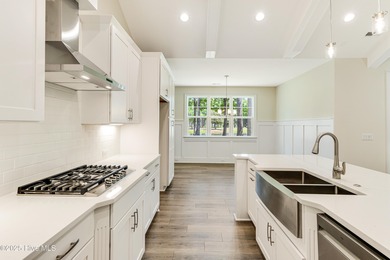 This brand new Riptide home with stunning setting and finishes on Sea Trail Golf Resort in North Carolina - for sale on GolfHomes.com, golf home, golf lot