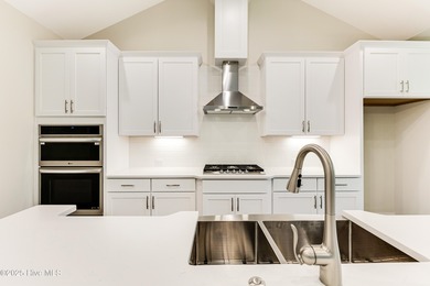 This brand new Riptide home with stunning setting and finishes on Sea Trail Golf Resort in North Carolina - for sale on GolfHomes.com, golf home, golf lot