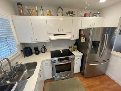 Enjoy serene lake views and resort-style living in this on Sunrise Lakes Phase III in Florida - for sale on GolfHomes.com, golf home, golf lot
