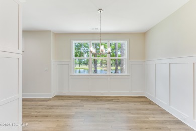 This brand new Riptide home with stunning setting and finishes on Sea Trail Golf Resort in North Carolina - for sale on GolfHomes.com, golf home, golf lot