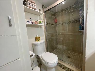 Enjoy serene lake views and resort-style living in this on Sunrise Lakes Phase III in Florida - for sale on GolfHomes.com, golf home, golf lot