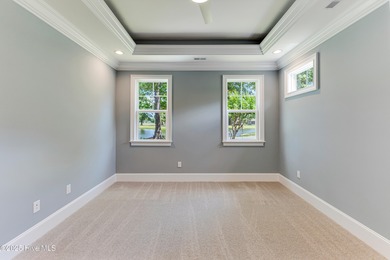 This brand new Riptide home with stunning setting and finishes on Sea Trail Golf Resort in North Carolina - for sale on GolfHomes.com, golf home, golf lot