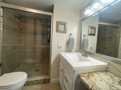 Enjoy serene lake views and resort-style living in this on Sunrise Lakes Phase III in Florida - for sale on GolfHomes.com, golf home, golf lot