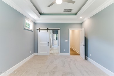 This brand new Riptide home with stunning setting and finishes on Sea Trail Golf Resort in North Carolina - for sale on GolfHomes.com, golf home, golf lot