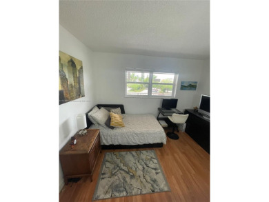 Enjoy serene lake views and resort-style living in this on Sunrise Lakes Phase III in Florida - for sale on GolfHomes.com, golf home, golf lot