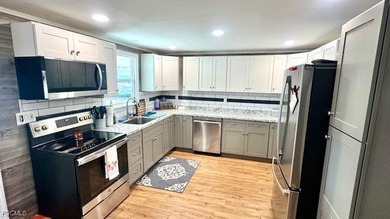 This beautifully remodeled manufactured home boasts 2 bedrooms on Riverbend Golf and Country Club in Florida - for sale on GolfHomes.com, golf home, golf lot