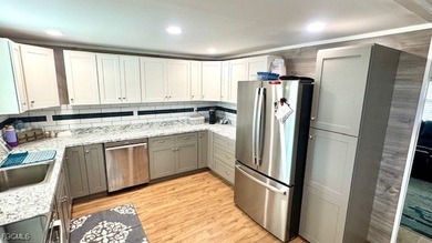 This beautifully remodeled manufactured home boasts 2 bedrooms on Riverbend Golf and Country Club in Florida - for sale on GolfHomes.com, golf home, golf lot