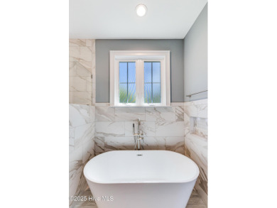 This brand new Riptide home with stunning setting and finishes on Sea Trail Golf Resort in North Carolina - for sale on GolfHomes.com, golf home, golf lot