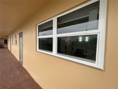 Enjoy serene lake views and resort-style living in this on Sunrise Lakes Phase III in Florida - for sale on GolfHomes.com, golf home, golf lot