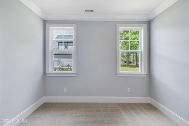 This brand new Riptide home with stunning setting and finishes on Sea Trail Golf Resort in North Carolina - for sale on GolfHomes.com, golf home, golf lot