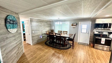 This beautifully remodeled manufactured home boasts 2 bedrooms on Riverbend Golf and Country Club in Florida - for sale on GolfHomes.com, golf home, golf lot