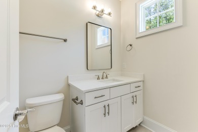 This brand new Riptide home with stunning setting and finishes on Sea Trail Golf Resort in North Carolina - for sale on GolfHomes.com, golf home, golf lot
