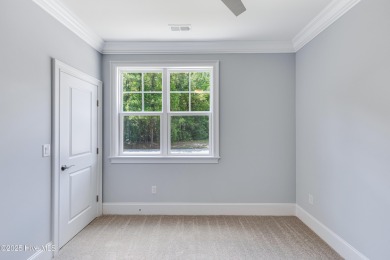 This brand new Riptide home with stunning setting and finishes on Sea Trail Golf Resort in North Carolina - for sale on GolfHomes.com, golf home, golf lot
