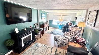 This beautifully remodeled manufactured home boasts 2 bedrooms on Riverbend Golf and Country Club in Florida - for sale on GolfHomes.com, golf home, golf lot