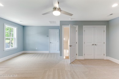 This brand new Riptide home with stunning setting and finishes on Sea Trail Golf Resort in North Carolina - for sale on GolfHomes.com, golf home, golf lot