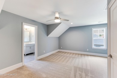 This brand new Riptide home with stunning setting and finishes on Sea Trail Golf Resort in North Carolina - for sale on GolfHomes.com, golf home, golf lot
