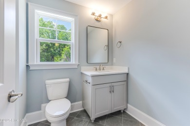 This brand new Riptide home with stunning setting and finishes on Sea Trail Golf Resort in North Carolina - for sale on GolfHomes.com, golf home, golf lot