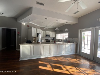 This brand new Riptide home with stunning setting and finishes on Sea Trail Golf Resort in North Carolina - for sale on GolfHomes.com, golf home, golf lot