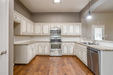 Welcome to this charming 3-bed, 2.5 bath home nestled on a on Mansfield National Golf Club in Texas - for sale on GolfHomes.com, golf home, golf lot