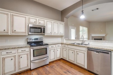 Welcome to this charming 3-bed, 2.5 bath home nestled on a on Mansfield National Golf Club in Texas - for sale on GolfHomes.com, golf home, golf lot