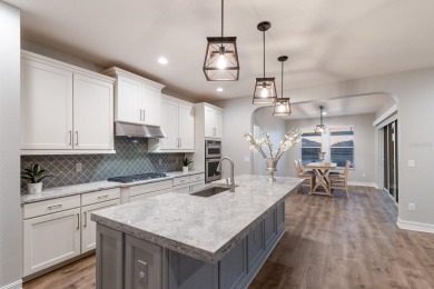 Under contract-accepting backup offers. CUSTOM WATERFRONT POOL on Esplanade Golf and Country at Lakewood Ranch in Florida - for sale on GolfHomes.com, golf home, golf lot