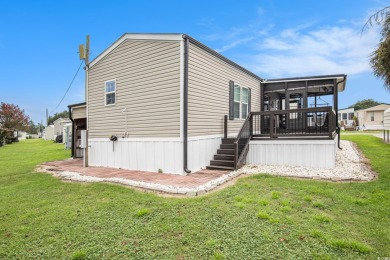 Welcome to this two-bedroom, two-bathroom home in the Waterway on Barefoot Resort and Golf Club  in South Carolina - for sale on GolfHomes.com, golf home, golf lot
