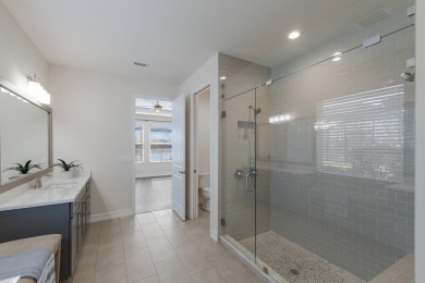 Under contract-accepting backup offers. CUSTOM WATERFRONT POOL on Esplanade Golf and Country at Lakewood Ranch in Florida - for sale on GolfHomes.com, golf home, golf lot