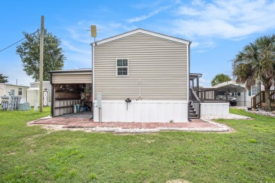 Welcome to this two-bedroom, two-bathroom home in the Waterway on Barefoot Resort and Golf Club  in South Carolina - for sale on GolfHomes.com, golf home, golf lot