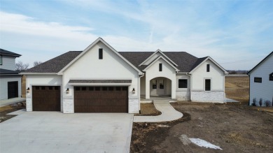 Discover the epitome of tranquil living in this charming
 on Otter Creek Golf Course in Iowa - for sale on GolfHomes.com, golf home, golf lot