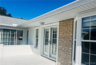 Charming Florida Designed Sun Terrace-Courtyard Entry Home on Royal Oaks Golf Club in Florida - for sale on GolfHomes.com, golf home, golf lot