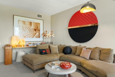 This 3-bed, 3-bath 3rd-floor condo at Desert Island combines on Desert Island Golf and Country Club in California - for sale on GolfHomes.com, golf home, golf lot