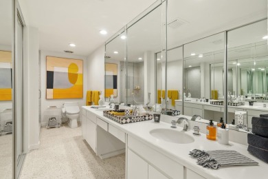 This 3-bed, 3-bath 3rd-floor condo at Desert Island combines on Desert Island Golf and Country Club in California - for sale on GolfHomes.com, golf home, golf lot