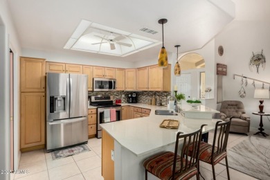 Enjoy the charm of this delightful 2-bedroom end-unit townhome! on Apache Wells Country Club in Arizona - for sale on GolfHomes.com, golf home, golf lot