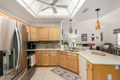 Enjoy the charm of this delightful 2-bedroom end-unit townhome! on Apache Wells Country Club in Arizona - for sale on GolfHomes.com, golf home, golf lot