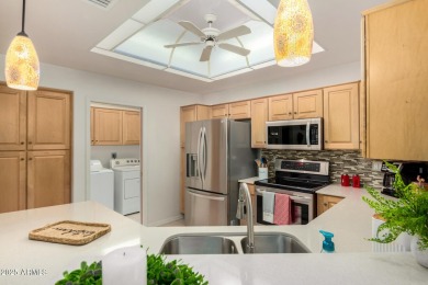 Enjoy the charm of this delightful 2-bedroom end-unit townhome! on Apache Wells Country Club in Arizona - for sale on GolfHomes.com, golf home, golf lot