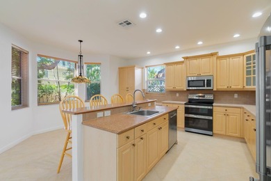 Beautifully maintained 4-bedroom, 2.5-bath home with a 2-car on The Links At Madison Green in Florida - for sale on GolfHomes.com, golf home, golf lot