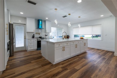 This beautifully remodeled home is in one of St Petersburg's on Pasadena Yacht and Country Club in Florida - for sale on GolfHomes.com, golf home, golf lot