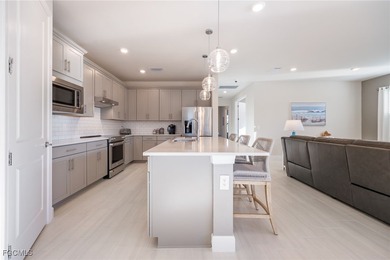 Stunning pool home with peaceful lanai retreat nestled in the on River Hall Country Club in Florida - for sale on GolfHomes.com, golf home, golf lot