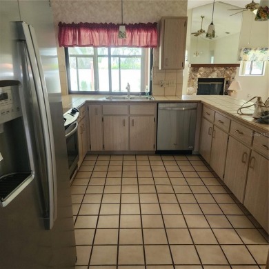 This meticulously maintained one owner home offers over 2,900 on The Grand Club - Pine Lakes Course in Florida - for sale on GolfHomes.com, golf home, golf lot
