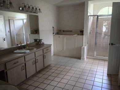 This meticulously maintained one owner home offers over 2,900 on The Grand Club - Pine Lakes Course in Florida - for sale on GolfHomes.com, golf home, golf lot
