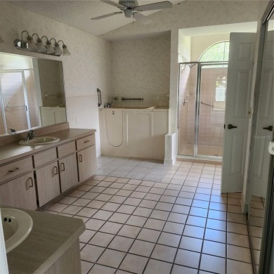 This meticulously maintained one owner home offers over 2,900 on The Grand Club - Pine Lakes Course in Florida - for sale on GolfHomes.com, golf home, golf lot