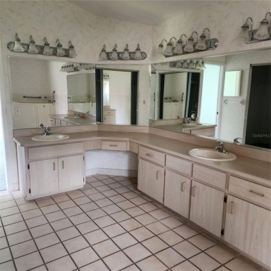 This meticulously maintained one owner home offers over 2,900 on The Grand Club - Pine Lakes Course in Florida - for sale on GolfHomes.com, golf home, golf lot